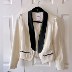 Off-white blazer with black and bow accents